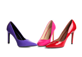 Stylish high heeled shoes on white background