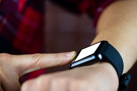 Person pointing on smart watch