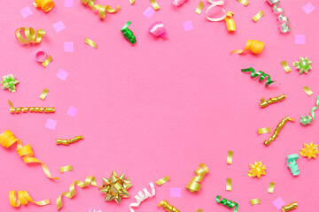 Obraz na płótnie Canvas Frame made of confetti on pink background