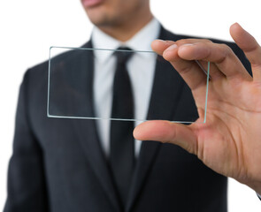 Mid section of businessman showing transparent interface