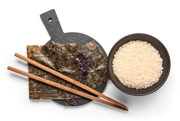 Board with natural nori sheets, chopsticks and bowl of rice isolated on white background