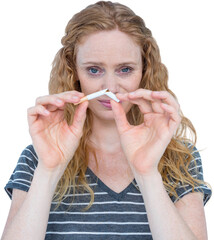 Portrait of blonde woman snapping a cigarette