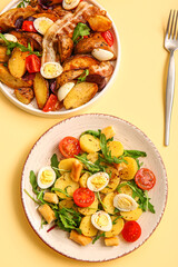 Plates of different potato salads on beige background, top view