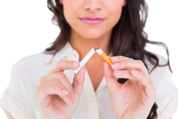 Pretty brunette breaking a cigarette
