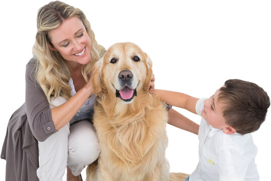 Mother and son with golden retriever