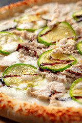 Freshly baked chicken pizza with zucchini and balsamic sauce
