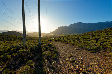A view over hills towards high mountains in the distance, near Worcester, Western Cape,  South Africa.