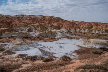 Landscape of multi-colored clay dunes. Mars on earth.