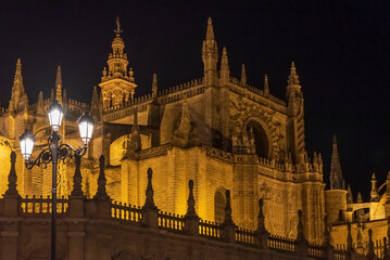 Fototapeta na wymiar Seville Cathedral is the third largest church in the world and one of the beautiful examples of Gothic and baroque architectural styles and Giralda the bell tower of is 104.1 meters high 