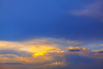 Illuminated clouds with twilight . Evening sky background