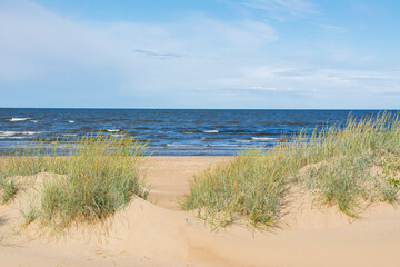 Fototapeta na wymiar View of the sand dunes and Gulf of Bothnia on the background, Marjaniemi, Hailuoto, Finland