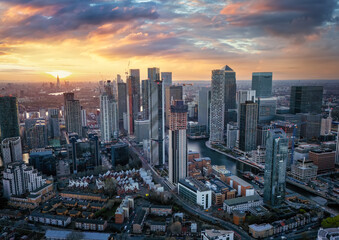 Fototapeta na wymiar Aerial sunset view of the residential and corporate skyscrapers at Canary Wharf London, England, with the skyline of the City in the background