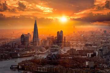 A beautiful sunset behind the London skyline with Tower Bridge, River Thames and the corporate skyscrapers