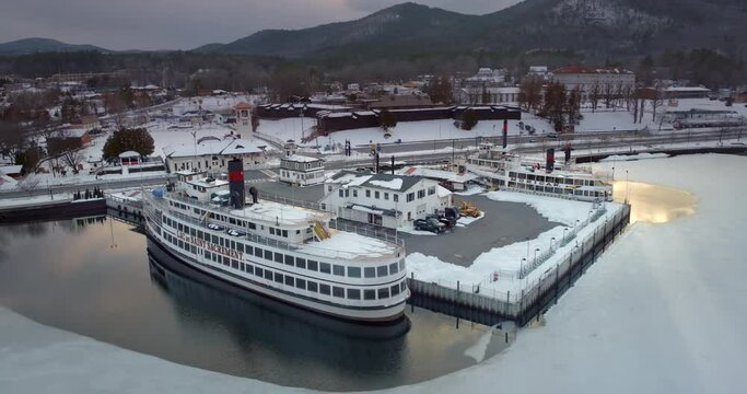 4k drone footage of Pier and Main Street in Lake George in Winter