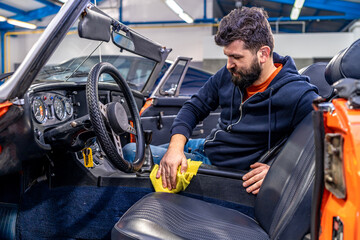 manual cleaning of the interior of an old car, cabriolet