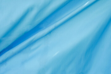 Blue cloth background abstract with soft waves