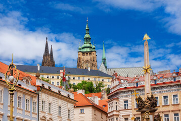 Fototapeta na wymiar View of Prague historical center with St. Vitus Cathedral beautiful gothic spires and Column of the Holy Trinity from Mala Strana Square
