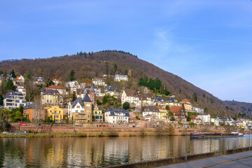 The barge MINERVA, sailing down the Neckar river and transporting scrap metal, passes the Old Town of Heidelberg, Baden-Württemberg, Germany, Europe, February 22, 2023.