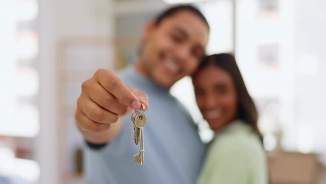 Couple, hands and kissing with keys in real estate, property or new home owners in relationship. Hand of happy woman and man holding key to apartment, house loan or mortgage investment and asset