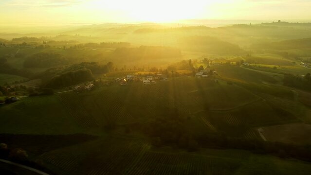 Aerial 4K drone footage of Kog during sunrise. It is a village in the hills northeast of Ormož in northeastern Slovenia, right on the border with Croatia.