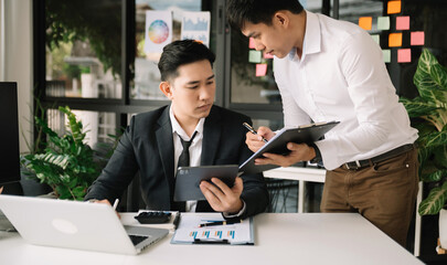 Portrait of success business people working together in home office. Couple teamwork startup concept.