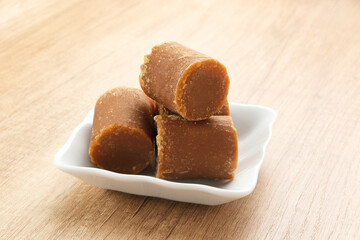 Cylindrical Brown palm sugar, food ingredient
