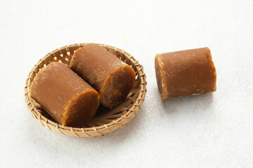 Cylindrical Brown palm sugar, food ingredient
