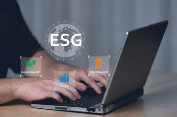 ESG environment social governance investment business concept,Asian man sitting using a computer to...