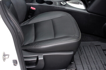 Close up passenger seats. Leather black interior.