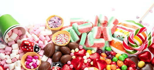 Various sweets assortment. Candy, bonbon, chocholate on white background.