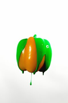 Vertical shot of colorful paint on a bellpepper