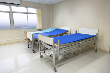 Recovery Room with beds and comfortable medical. Interior of an empty hospital room. Clean and empty room with a bed in the new medical center