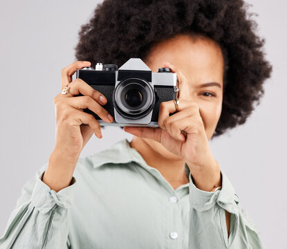 Portrait, camera photographer and black woman in studio isolated on a white background. Photography, professional and person or female ready to start filming, photoshoot or taking paparazzi picture.