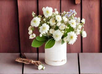 Bouquet of white flowers on wooden background.