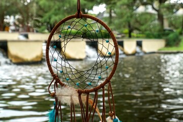 Dreamcatcher willow hoop with a beautiful waterfall in the background