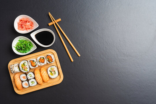 Japanese sushi with soy sauce, ginger and algae salad