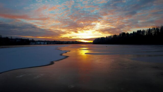 Frozen lake under a sunset sky