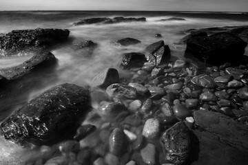 Black and white shot of a rocky coastline in Newport, Rhode Island