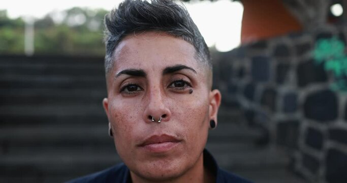 Gay woman looking on camera in the city