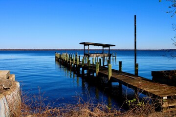 Wooden pier on the scenic blue lake