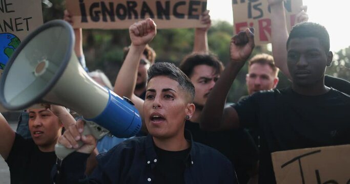 Crowd of multiracial people fight for climate change - Group of demonstrators protest in the city 