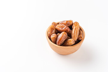Fresh date fruits in bowl on white background with copyspace
