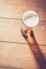 Beer glass on wooden table