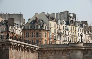 Fototapeten Beautiful shot of historic building exteriors in Paris, France © Crakehall/Wirestock Creators