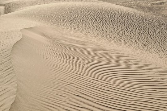 Closeup shot of textured sand dunes in a desert