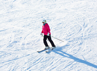 Skier on a slope enjoy fresh snow - 588710098
