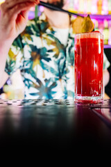 man hand bartender making cocktail in glass on the bar counter
