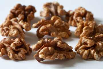 Peeled nuts are on the white table. local focus. Macro.