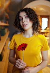woman holding a rose