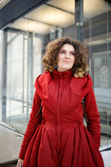 The girl is happy on the street in winter